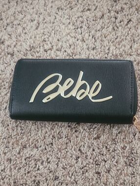 bebe Black Continental Zip Wallet with Gold Script Logo